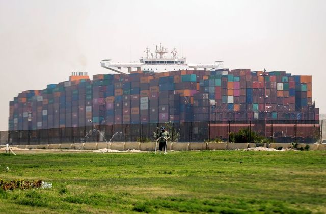Ship with massive load of containers passing down the Suez Canal - Reuters